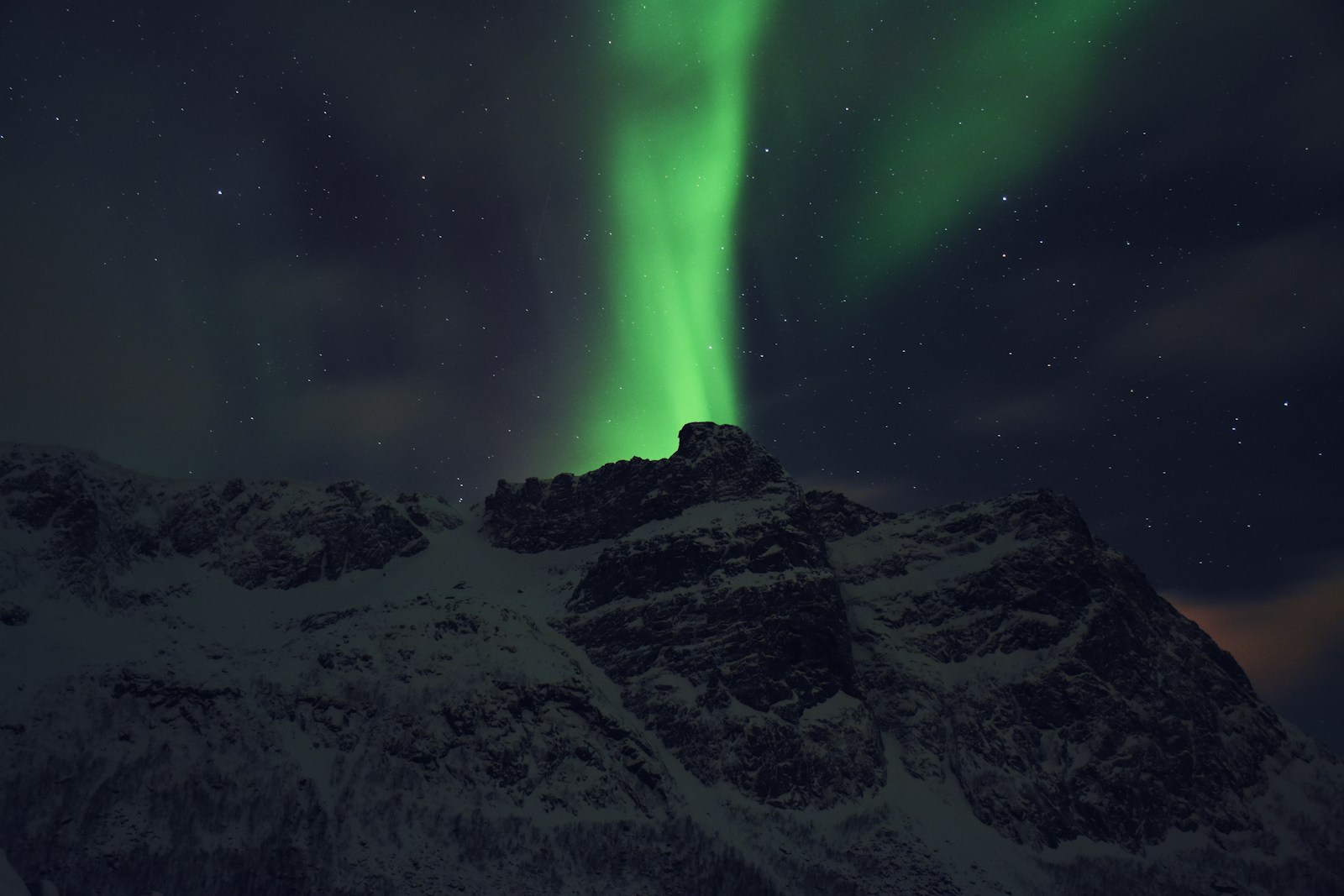 Aurora borealis over a Norwegian mountain